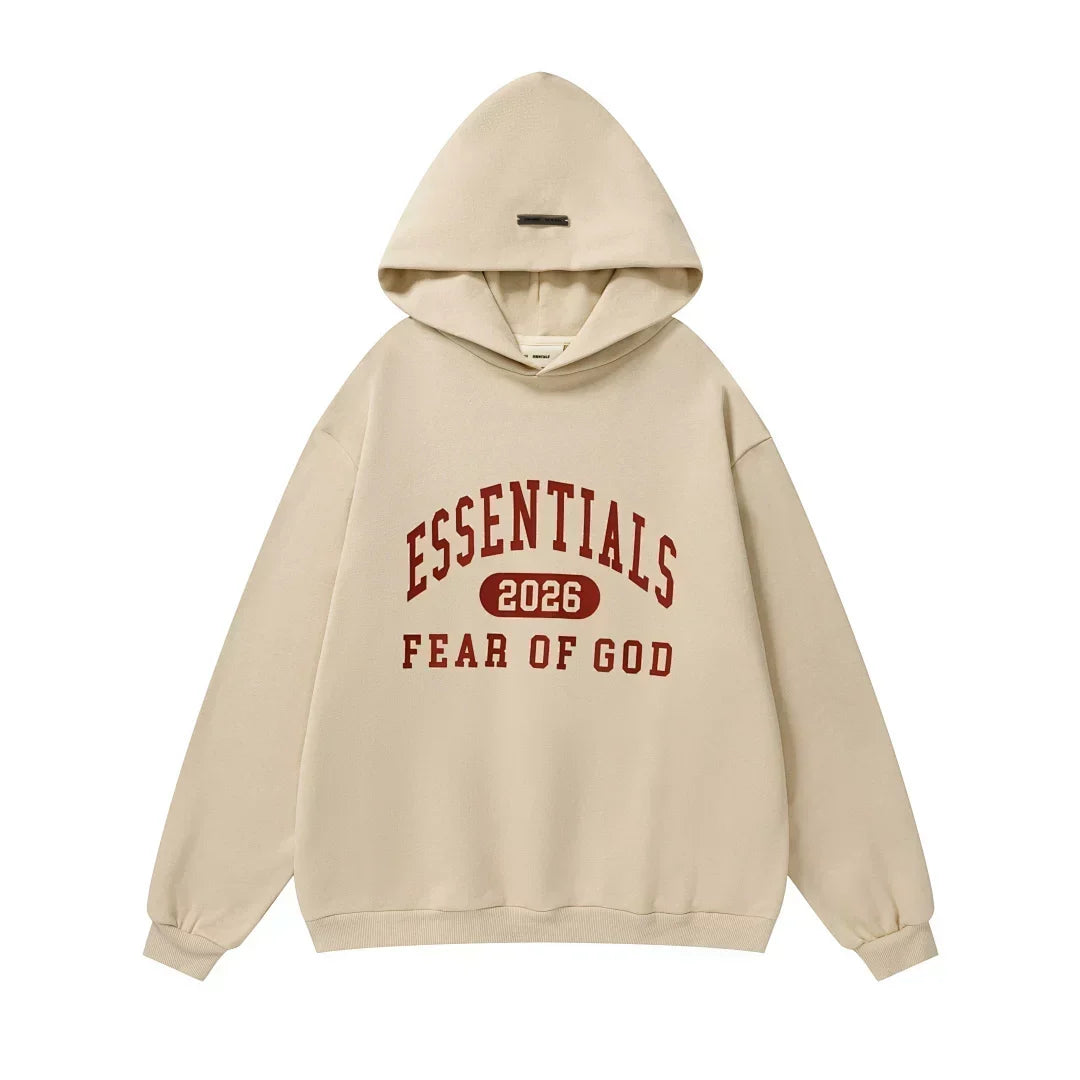 FOG Essentials 2026 Apricot Oversized Hoodie – Fear of God Varsity Graphic Sweatshirt